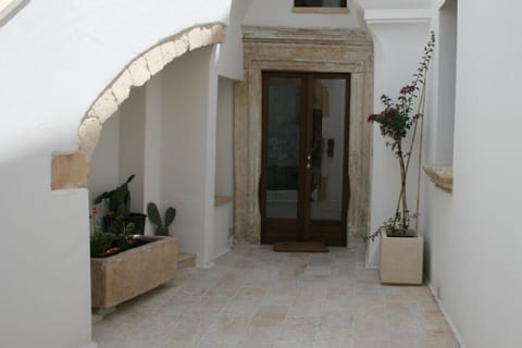 Entrance courtyard with old stone sink