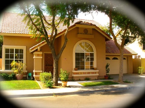 The home is surrounded by beautiful, lush, green tree's.