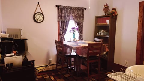 Dining area, small fridge, microwave, coffee maker, kettle, single burner