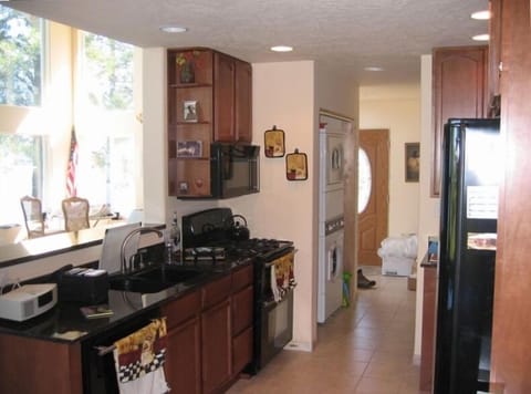 FULLY EQUIPPED KITCHEN WITH 5 BURNER GAS STOVE AND DOUBLE OVEN