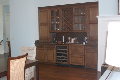 Wet bar, complete with wine fridge and two disguised pull out fridges