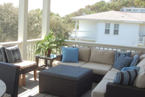 Screened in porch off kitchen, teak round table not shown