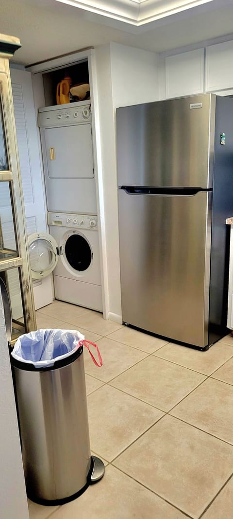 New refrigerator with washer and dryer closet in kitchen
