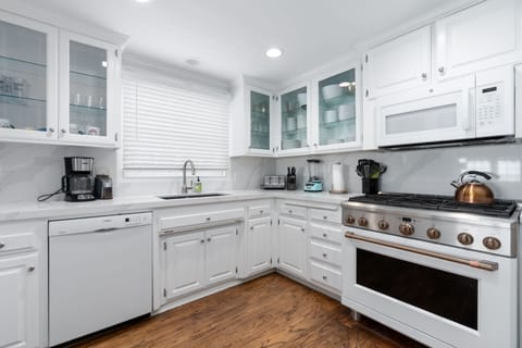 Beautiful new stove, countertops, deep sink. dishwasher, microwave, refrigerator