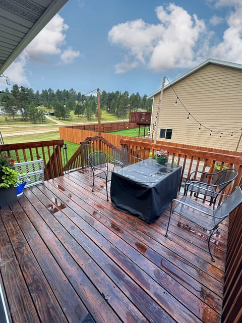 Upper level outdoor living space with fire pit. 