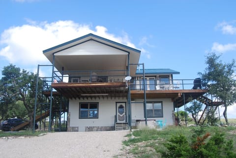Back entrance, carport, and hot tib