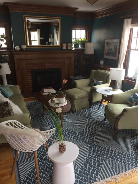 Living room, with fireplace and lots of windows