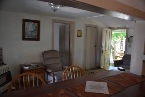 Living area, closed door lead to another bathroom, with stand up shower