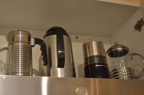 Milk frother, coffee thermos, coffee grinder, French coffee press.