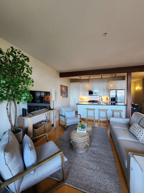 Charming and very coastal feel to your living room and kitchen!