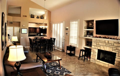 Spacious living room with sofa bed and fireplace