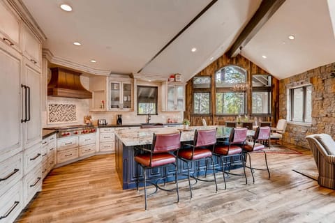 Experience culinary bliss in the fully equipped gourmet kitchen with premium appliances and a spacious island for meal prep. Perfect for creating unforgettable meals with loved ones.