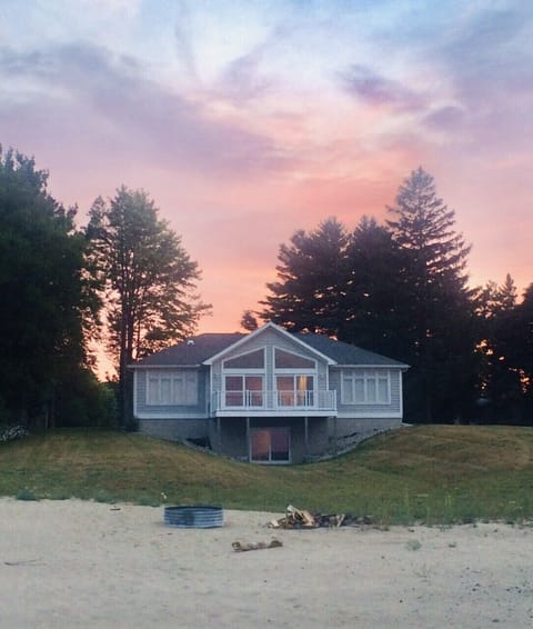 Back of the home that faces the lake. Includes a walk out basement.