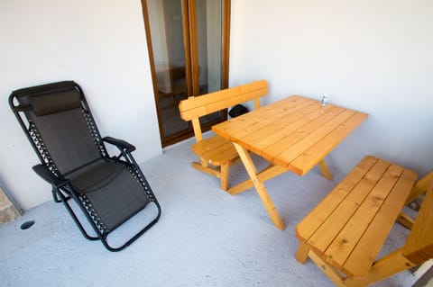 Spacious balcony with siting area.