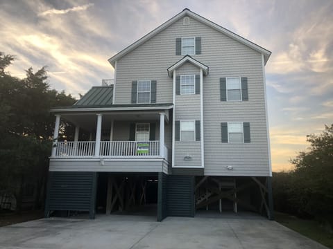 Raised house for covered parking