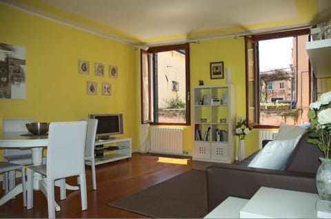 Very bright living room with canal and garden view.