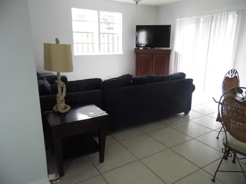 The living room opens onto a private deck