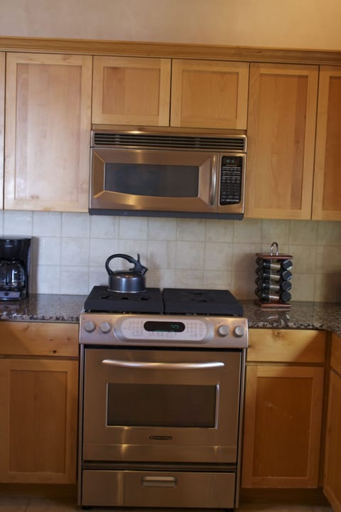 Gas stove; microwave and spacious countertops.