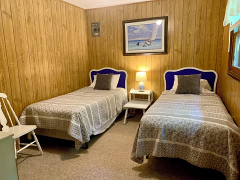 Secondary bedroom with two comfortable twin beds.