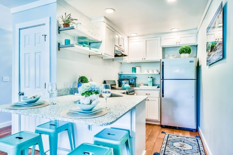 Modern kitchen: Fridge, dishwasher, oven, stove, microwave, & keurig coffee bar