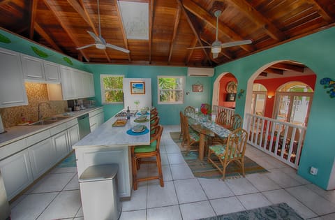 Kitchen with Stainless steel,  gas cooktop and bar for eating or serving