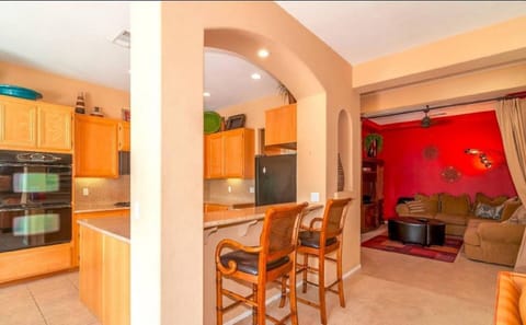 The counter can fit 2 on the stools.