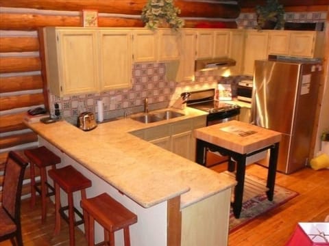 Fully equipped kitchen with granite counters and stainless appliances