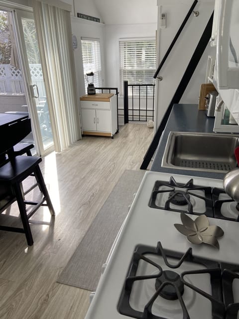 Large outdoor deck off kitchen. BBQ grill, Outdoo table seats 6-8 & other chairs