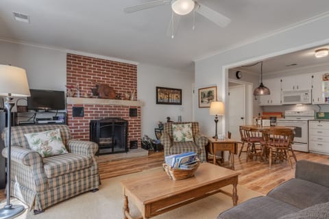 Living Room features cozy wood burning fireplace
