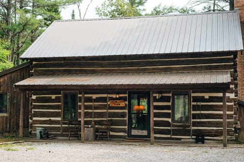 Uncle Tom's Cabin was carefully relocated from the Upper Peninsula log by log. It has a rich history and is now at home on this private property on the Au Sable River.