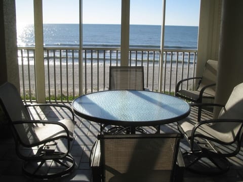 terrace with dining for 4 people overlooking beach