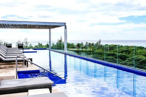 Gorgeous rooftop pool and lounge area with ocean views
