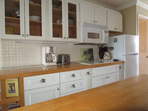 Butcher block counter tops and ample kitchen storage