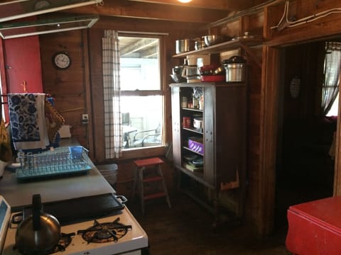 entering camp-the kitchen. window opens to screened porch