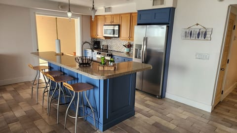 Kitchen island, fridge, oven, dishwasher, sink