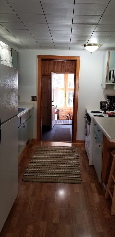 Kitchen leading to 3 season porch