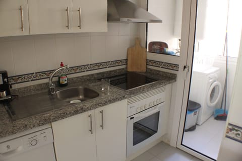 Kitchen showing cooker and dishwasher