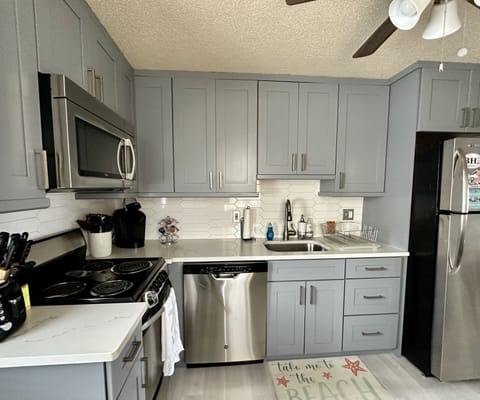 Kitchen - Full size fridge, stove, microwave and dishwasher