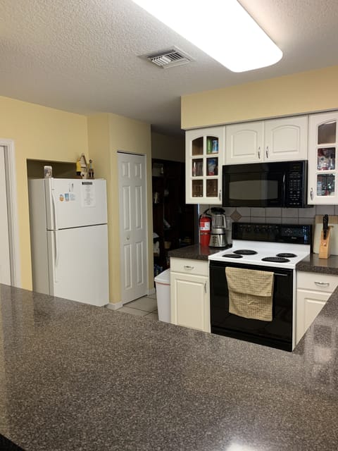 Kitchen view to include refrigerator freezer