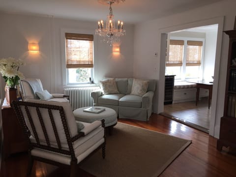 Soft hues & natural woven window shades set a tranquil tone in LR & thru house