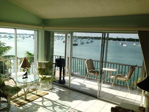 WRAP AROUND WATER VIEW WITH INSIDE & OUTSIDE BALCONY- OVERLOOKS THE POOL & DOCKS