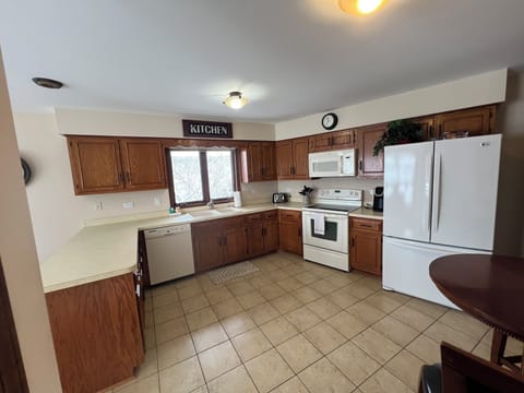 Kitchen with cookware, utensils & essential appliances