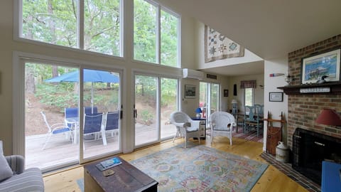 Living room and dining room have sliders to the deck