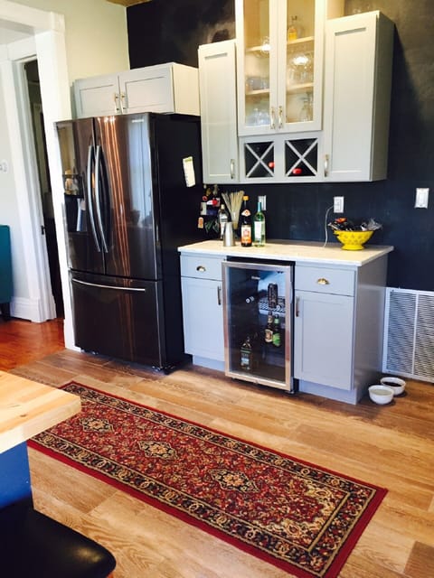 Kitchen featuring bar area w/ beverage fridge
