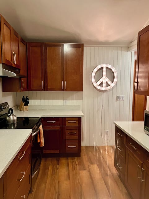 Lots of counter space and cooking/baking supplies in this updated kitchen