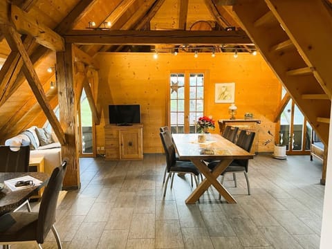 The spacious and comfortable Dinning and Living Room with two Sofas. 