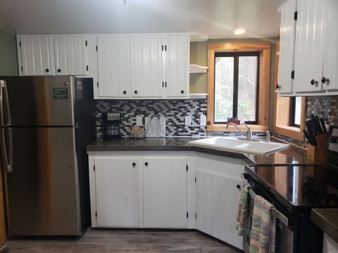 Kitchen with utensils, Plates, Cups, Cookware