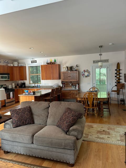 Living room, kitchen & dining table open floor.