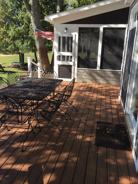 Lakeside deck with screened-in porch for board games or bug-free dining.