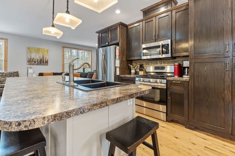 Expansive Kitchen - Open concept home with the kitchen right in the middle. It is where everyone gathers to enjoy time together.